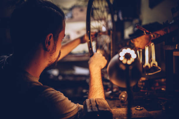 istock Guy works alone in repair shop 936610058