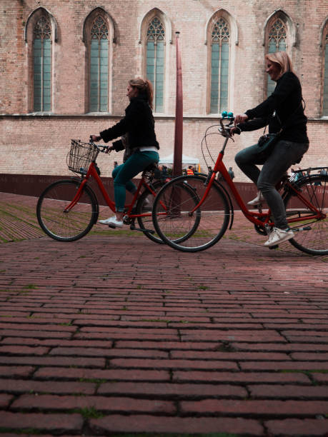 Image showing two young girls riding a bike at Born quarter, Barcelona (exactly, in front of Fossar de les Moreres Monument).