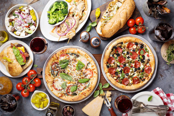istock Big dinner with pizza and sandwiches 936611080