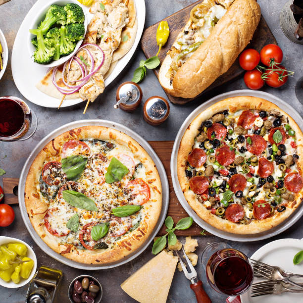 istock Big dinner with pizza and sandwiches 936611434