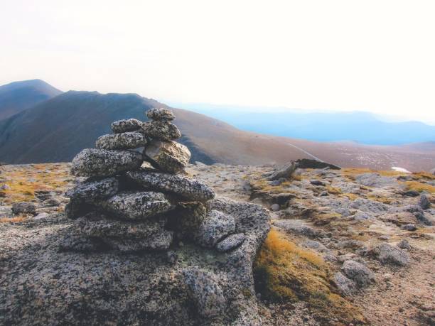 istock hiking cairn in the mountains 936615232