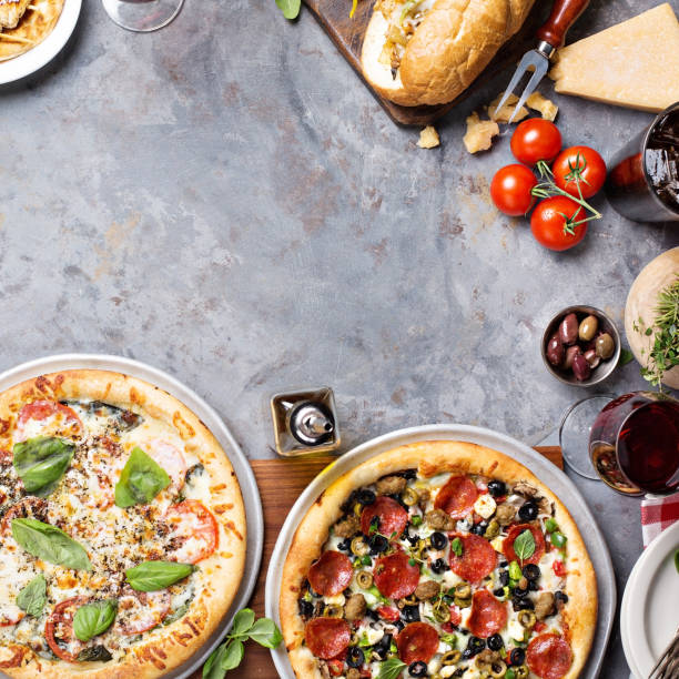 istock Margherita and pepperoni pizza with basil 936615336