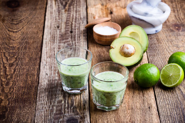 istock Green vegetables smoothie in glasses with ingredients 936615588
