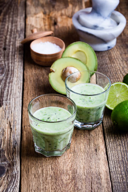 istock Green vegetables smoothie in glasses with ingredients 936615592