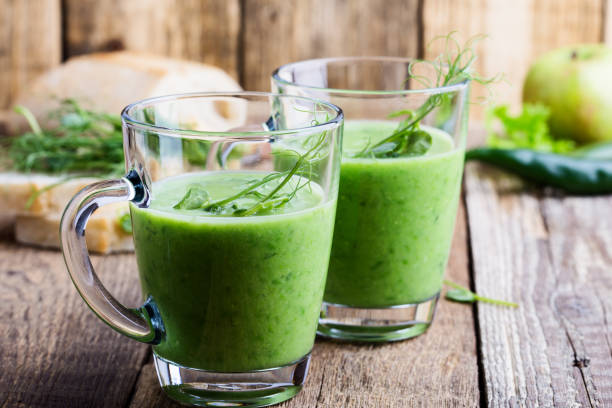 istock Green pea cream soup in glass mug 936617934