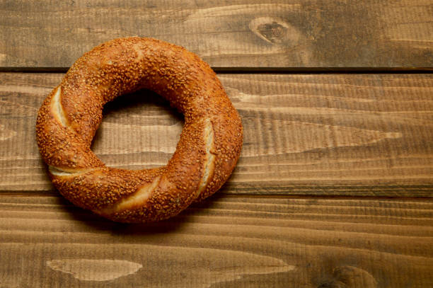 istock Simit, Turkish Bagel on Wood Background 936618770
