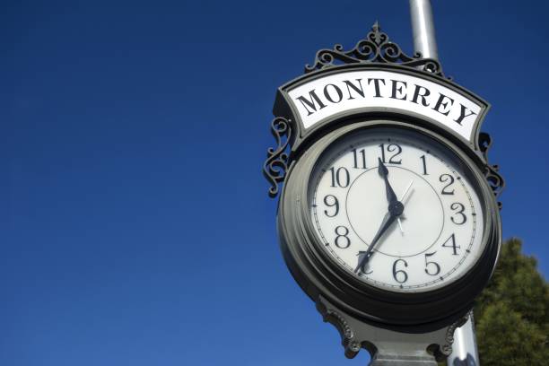 Monterey Harbor Entrance Street Clock near Fisherman's Wharf Monterey, California, USA - February 22, 2018: Street Clock at entrance to Monterey Peninsula Harbor near Old Fisherman’s Wharf city of monterey california stock pictures, royalty-free photos & images