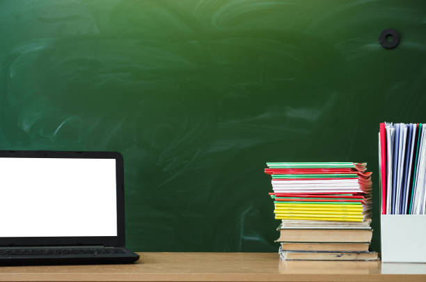 istock Education background with copy space. Student or teacher desk table on blackboard background. Classroom. Back to school. 936625140