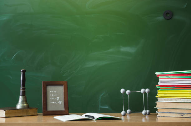 istock Education background with copy space. Student or teacher desk table on blackboard background. Classroom. Back to school. 936625544