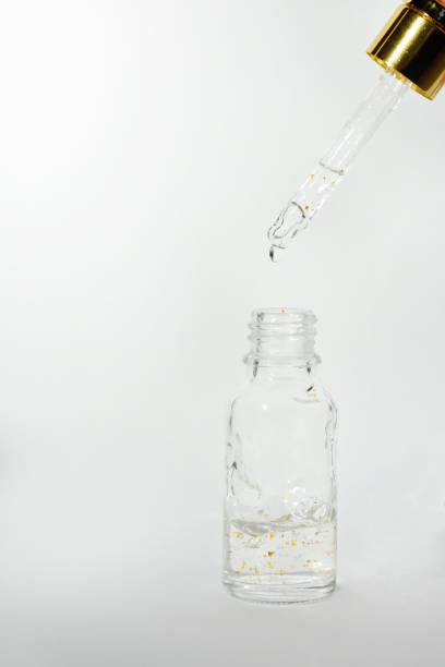 istock Luxurious facial serum container with dropper on white background 936626430