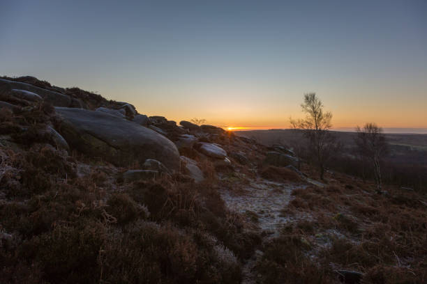istock Sun rising on rocks and bracken 936626706