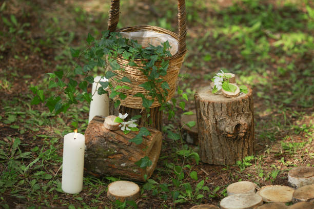istock Details of a wedding ceremony: stumps, candles, basket, greenery 936629122