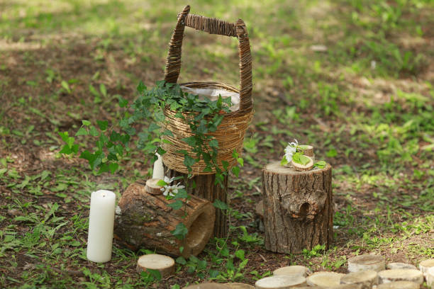 istock Details of a wedding ceremony: stumps, candles, basket, greenery 936629154