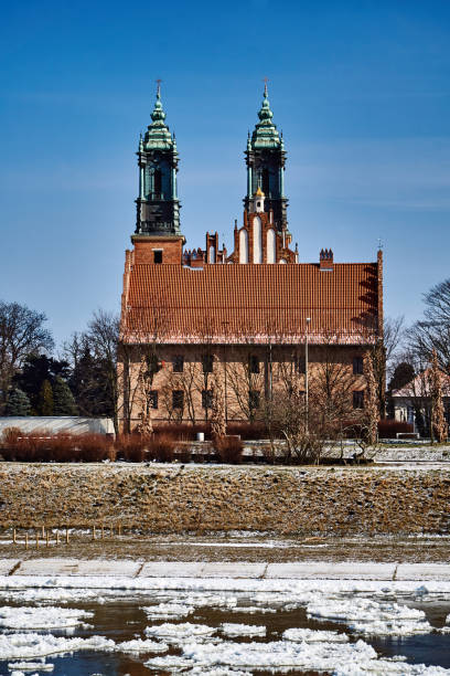 istock Urban landscape with river Warta and the cathedral towers 936629400