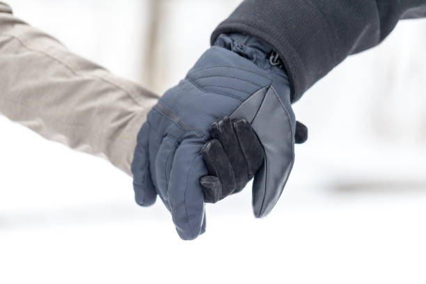 istock a girl is holding a male hand 936635374