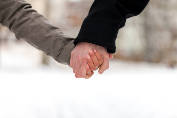 istock a girl is holding a male hand 936635400
