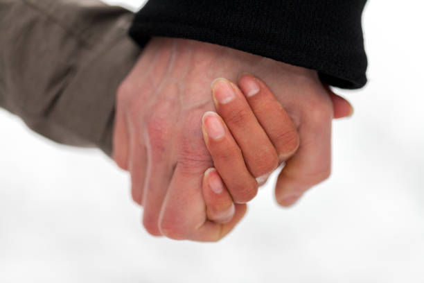 istock a girl is holding a male hand 936635428