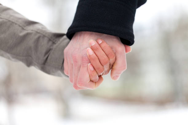 istock a girl is holding a male hand 936635432