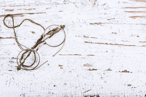 istock Antique round spectacles 1920s on painted wooden surface, place for text or design elements 936638644