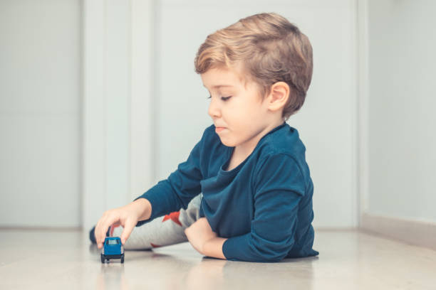 istock Small boy and his favorite car toy. 936639070