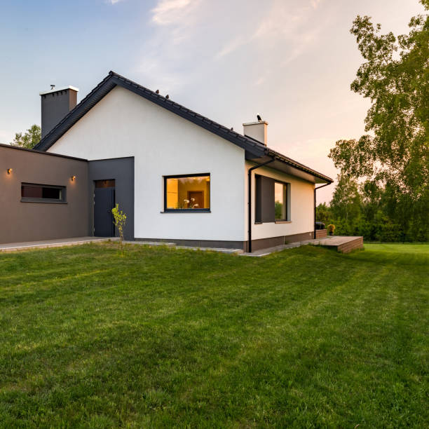 istock Stylish house with large lawn 936639452