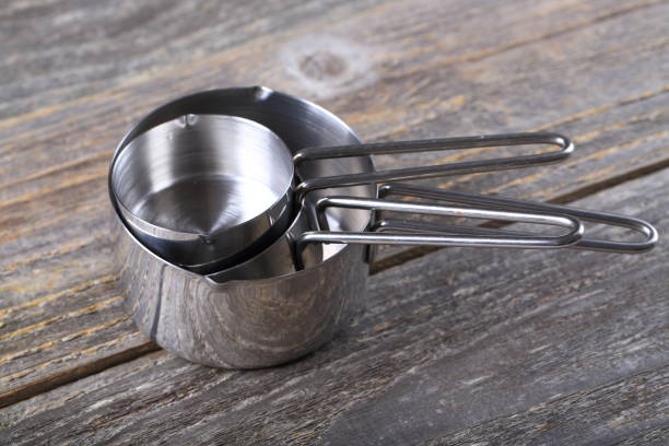 istock Set of measuring cups on wood 936643088