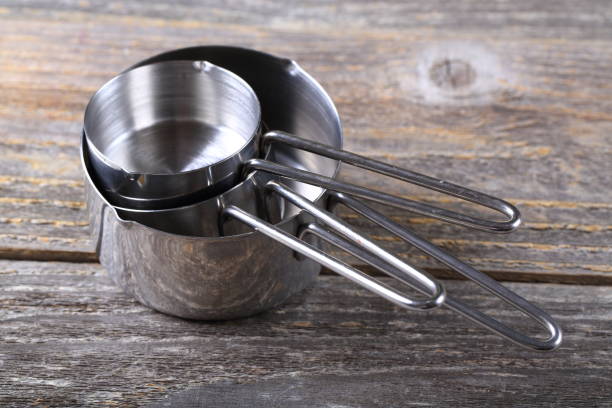 istock Set of measuring cups on wood 936643150
