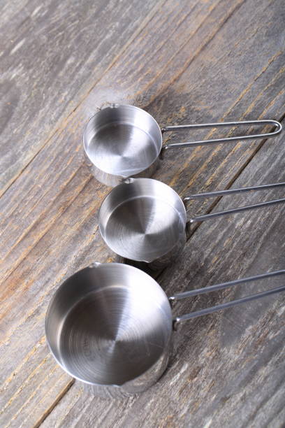 istock Set of measuring cups on wood 936643196