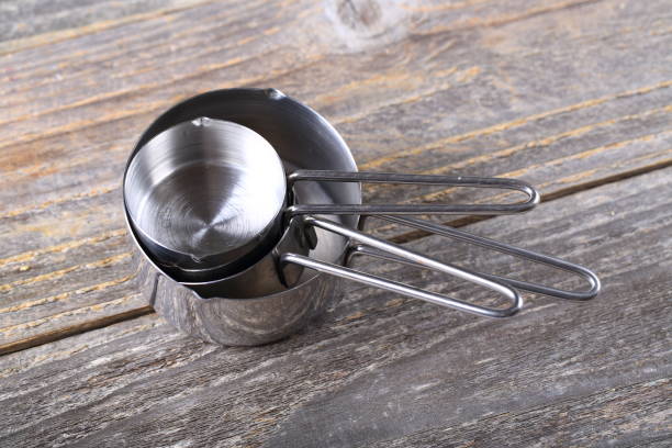istock Set of measuring cups on wood 936643198