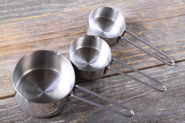 Set of measuring cups on wood