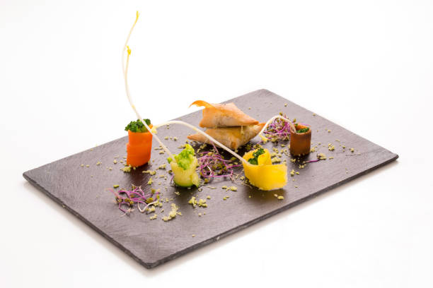 istock Slate tray with samousas and vegetables 936643498