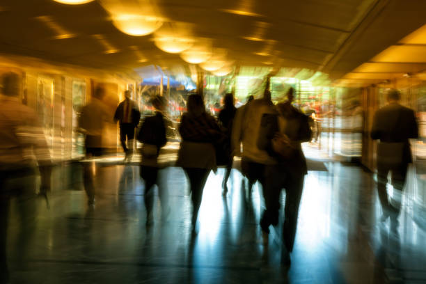 Motion blurred business people in corridor
