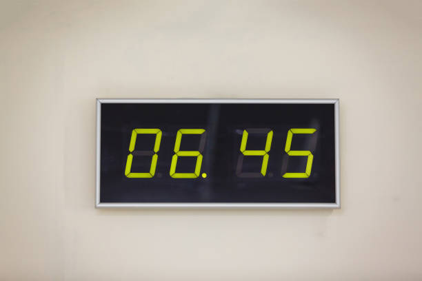 istock Black digital clock on a white background showing time 6 hours 45 minutes 936646400