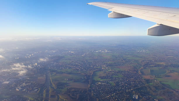 istock flying above the clouds in sunrise 936646598