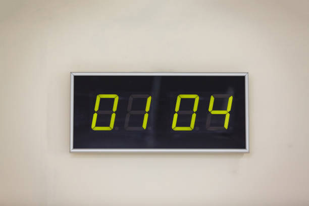 Black digital clock on a white background showing time Day of laughter (Fool's Day)