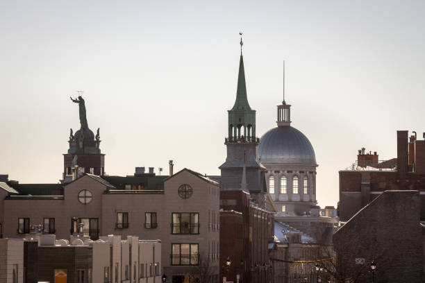 istock Marche Bonsecours in Montreal, Quebec, Canada, into the light during a winter morning, surrounded by other historical buildings. Bonsecours Market is one of the main attractions of Old Montreal 936647096