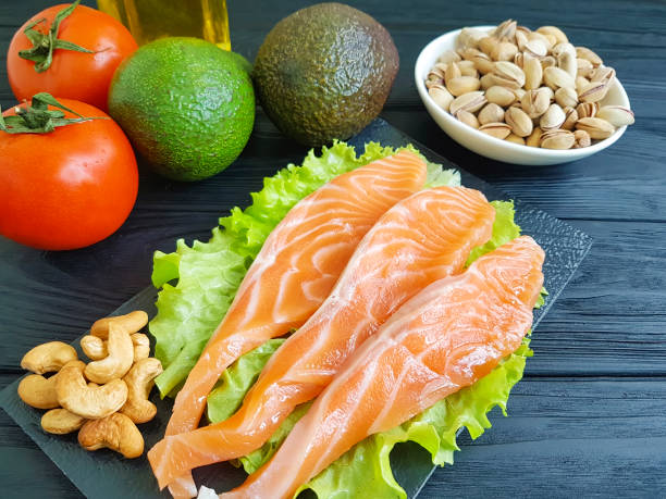 istock red fish, avocado on wooden 936649740