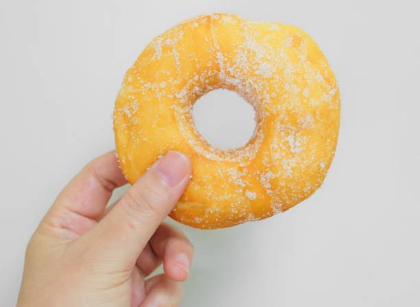 istock Hand Holding Delicious Glazed Donut with Sugar 936650038