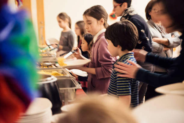 istock Children in line for self-serve buffet. 936650730