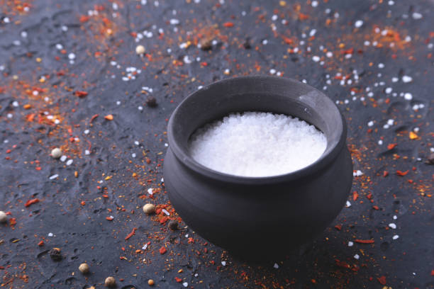 istock Red spices, salt and pepper on black marble. Black abstract background. Top view. 936653168