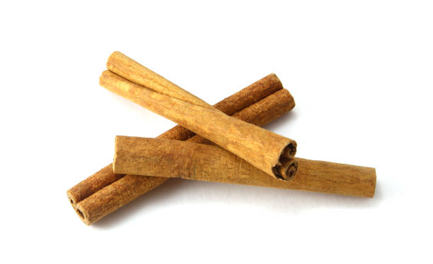 istock Top view of cinnamon sticks isolated on white. 936659234
