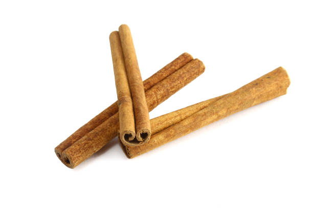 istock Top view of cinnamon sticks isolated on white. 936659292