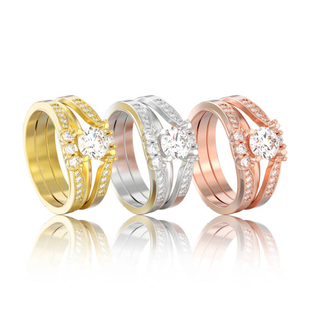 istock 3D illustration three isolated different gold two shanks decorative diamond rings with reflection 936662294