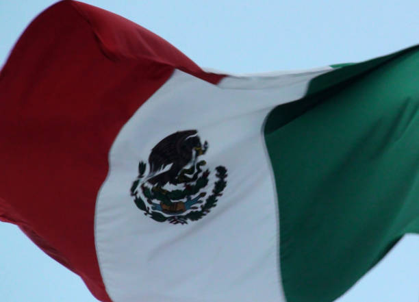 istock Mexican Flag Waving In Cancun Mexico 936662564