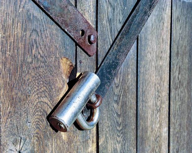 istock Padlock on a wooden door 936662584