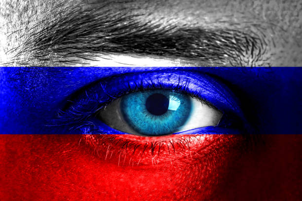 istock Human face painted with flag of Russia 936664938