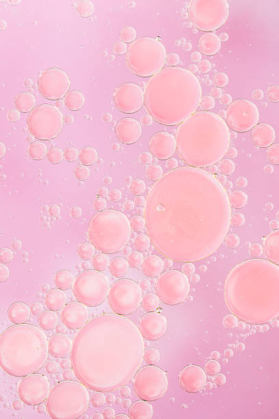 istock Large and small pink bubbles on pink background 936670782