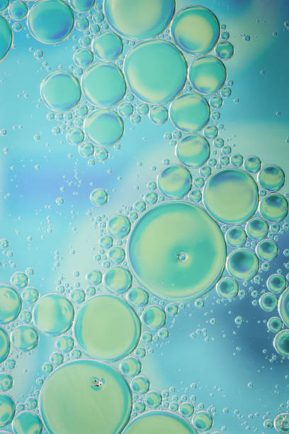 istock Large and small bubbles on blue, green and turquoise background 936670852
