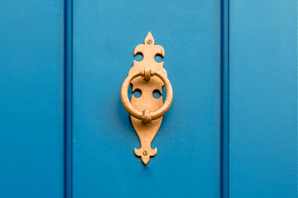 Old knockers on colored doors