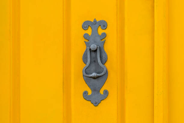Old knockers on colored doors